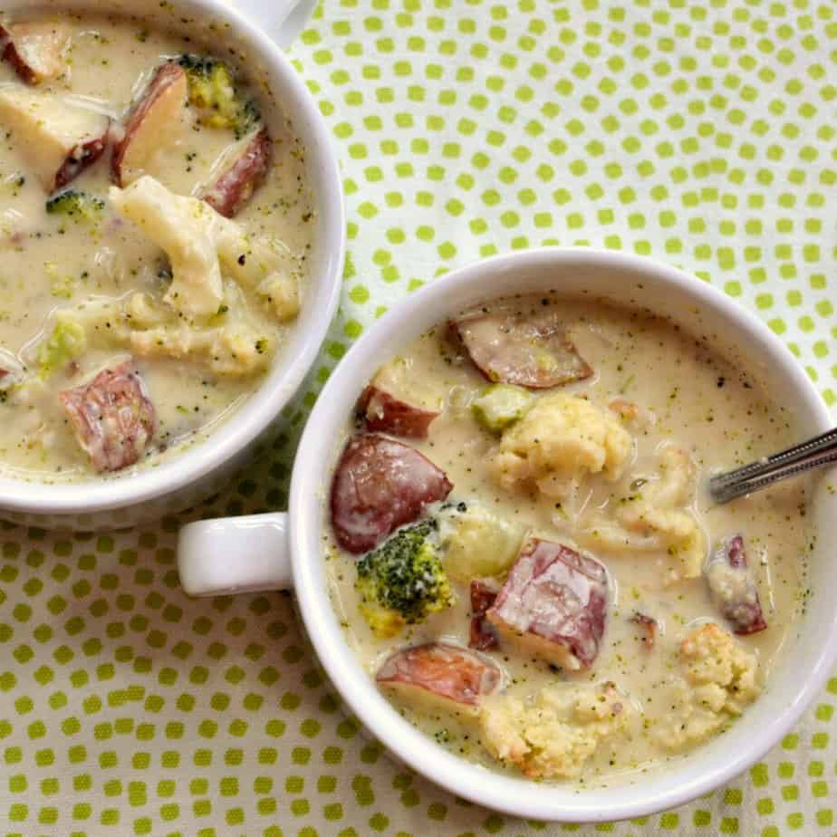 This family friendly creamy cheesy soup gets its unique taste and texture from roasting the vegetables.  If you prefer a creamier version simply puree 1-2 cups and add it back to the soup.