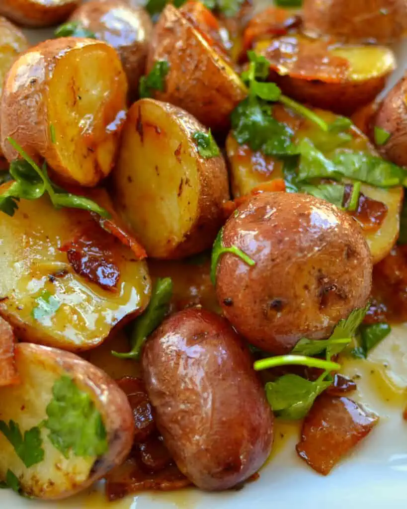This delectable Honey Mustard Potato Salad combines roasted red potatoes, crisp bacon, and a mouthwatering good sweet honey mustard vinaigrette that is drizzled over the top. 