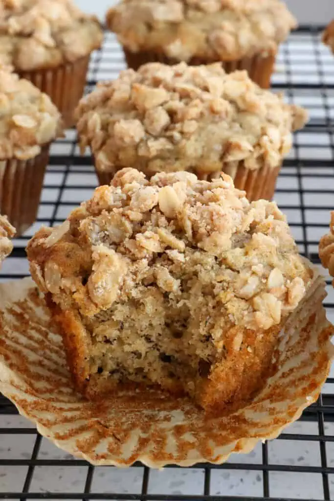 These bakery-style Banana Oatmeal Muffins with the sweet flavor of banana and cinnamon are crowned with a buttery oatmeal topping. 
