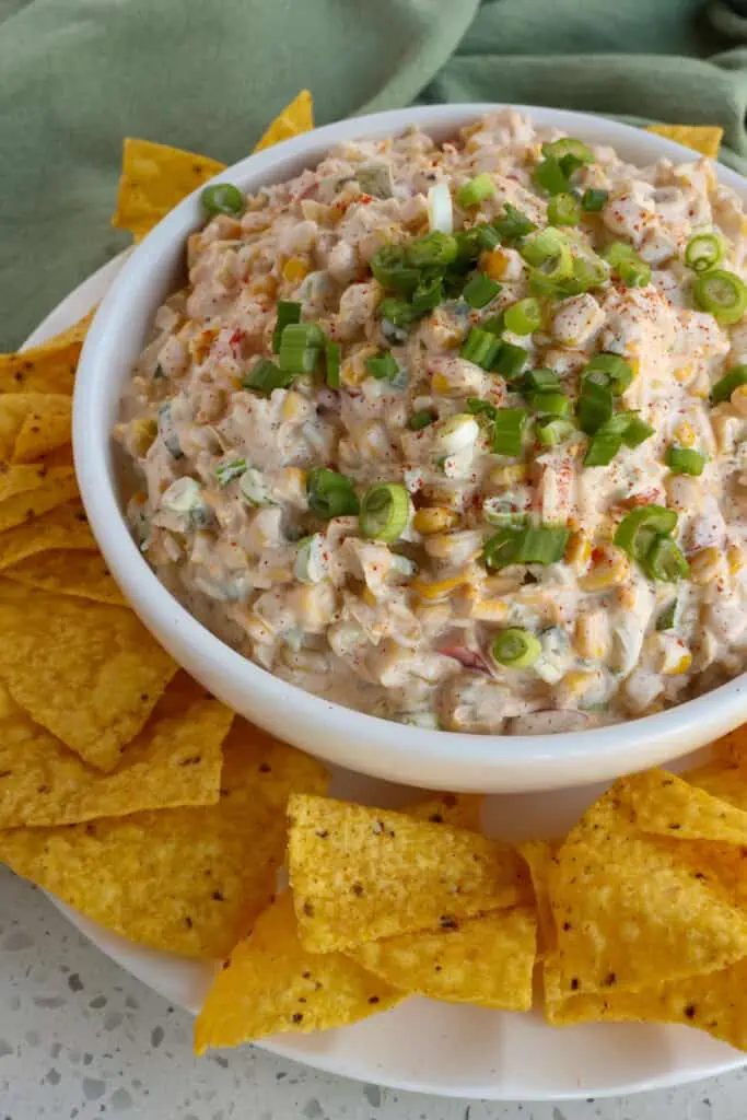 Serve corn dip with tortilla chips or Fritos scoops. 