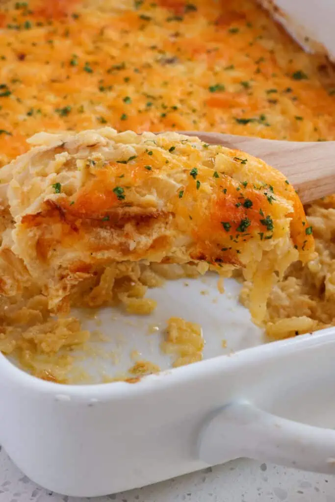 A super cheesy shredded hash brown casserole recipe made with ten common ingredients and in the oven in less than 15 minutes. 