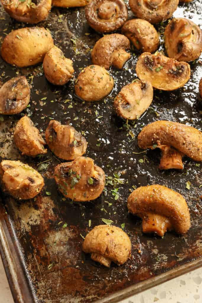 Tasty and easy Oven Roasted Mushrooms seasoned with kosher salt, fresh ground black pepper, garlic powder, and brown sugar. Garnish with fresh herbs like basil, thyme, parsley, or rosemary.