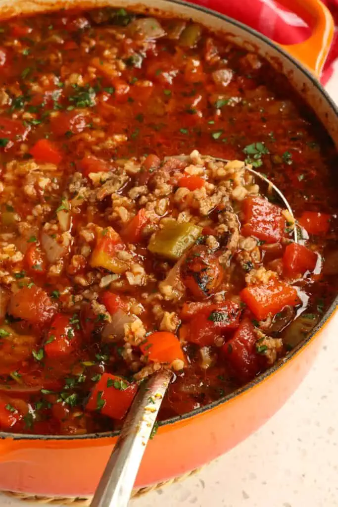 Ground beef, onions, sweet bell peppers, garlic, tomatoes, and rice are cooked and simmered in a perfectly seasoned beef and tomato broth creating a delectable home cooked soup.