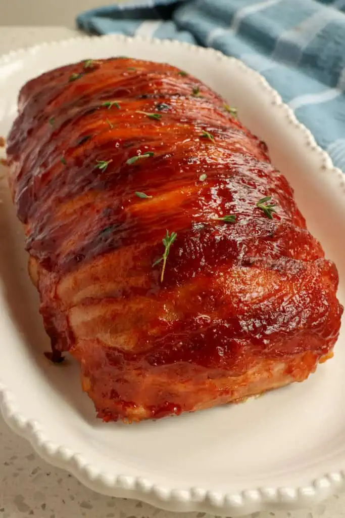 This Bacon Wrapped Meatloaf comes together quickly and easily with bacon and a four-ingredient glaze keeping it moist, flavorful, and tender. 