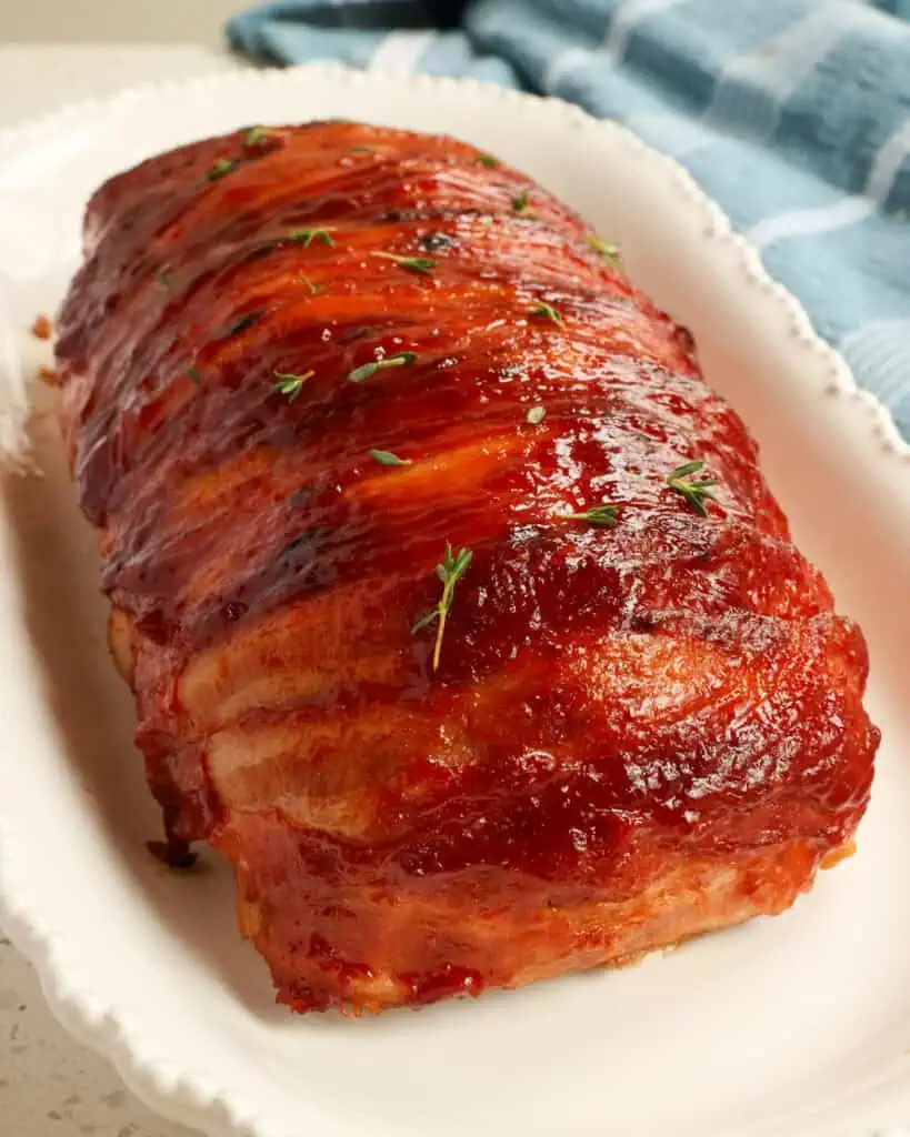 This Bacon Wrapped Meatloaf comes together quickly and easily with bacon and a four-ingredient glaze keeping it moist, flavorful, and tender. 