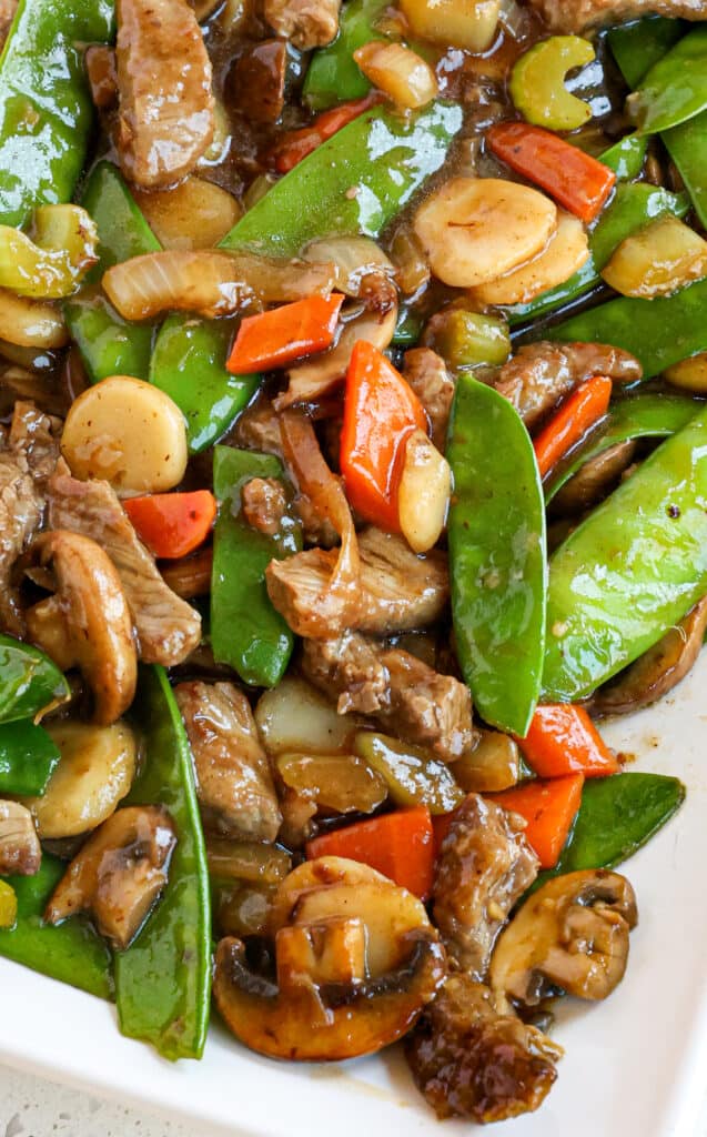 A tasty Beef Chop Suey recipe with bite-size pieces of seared steak, onion, celery, carrots, mushrooms, snow peas, and water chestnuts, all in a mouthwatering simple sauce.