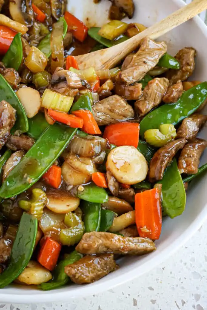 Beef Chop Suey combines tender bites of steak with onion, celery, carrots, mushrooms, snow peas, and water chestnuts, all in a tasty and simple five-ingredient sauce. 