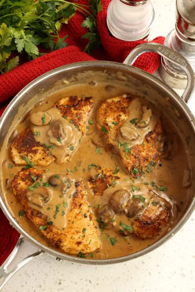 Easy Cajun Chicken is bursting with tons of flavor from Cajun spices and golden brown cremini mushrooms, all in a luscious sauce made with a few simple ingredients. 