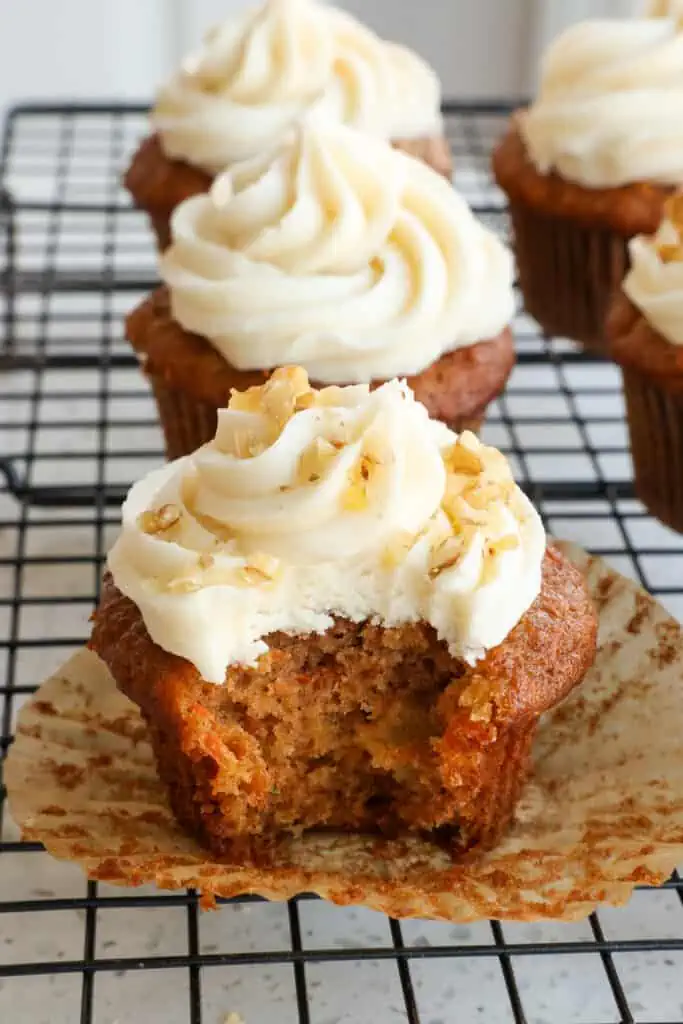 The best carrot cupcake recipe with crushed pineapple and the perfect blend of spices all topped with a delectable four-ingredient white chocolate cream cheese frosting.