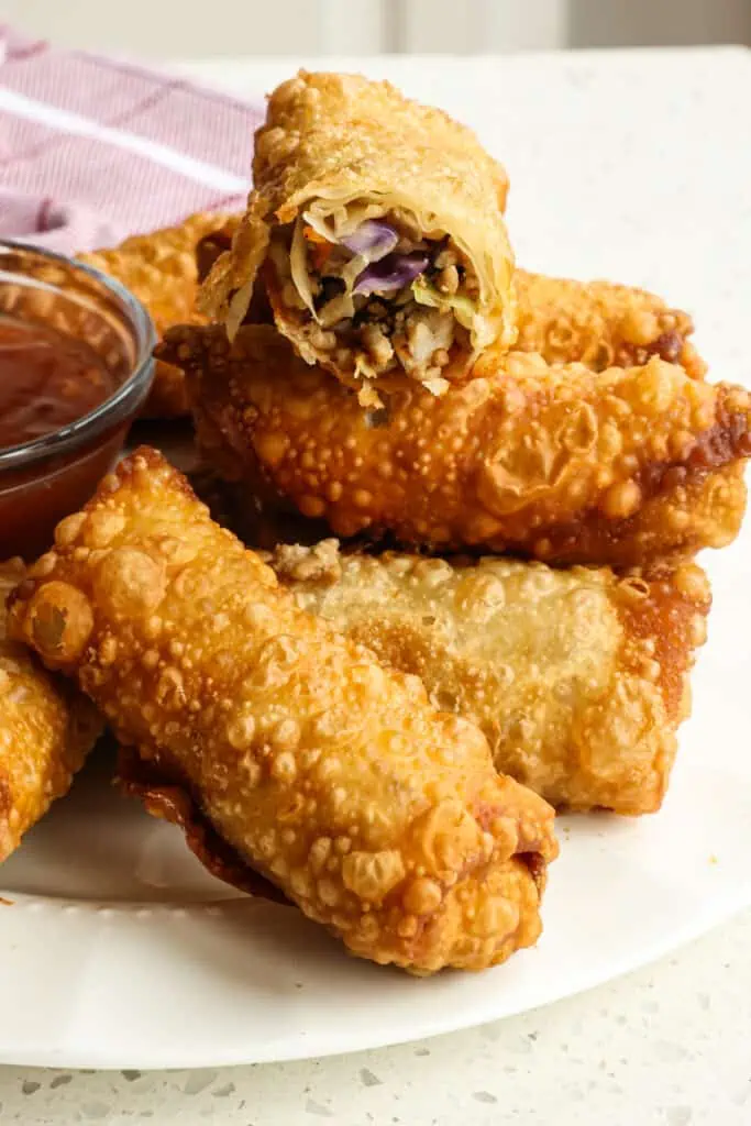 These crispy homemade Classic Egg Rolls are a cinch to make with ground pork, cabbage, carrots, and ginger, all rolled up in egg rolls wrappers and fried to golden perfection. 