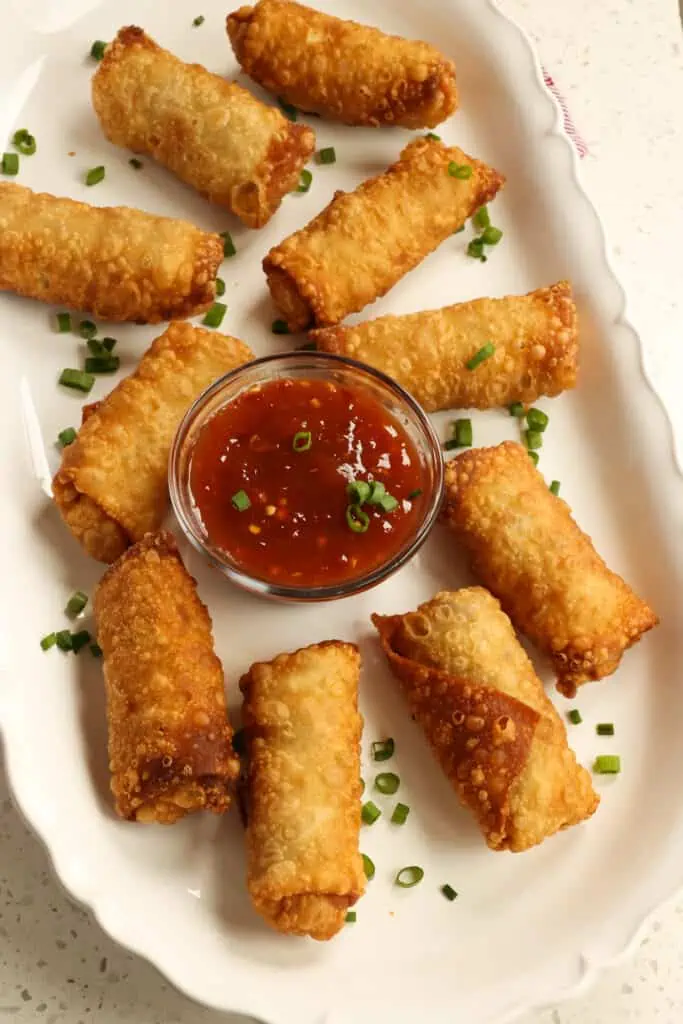 Delicious Homemade Egg Rolls are so easy to make with ground pork and prepackaged coleslaw mix.