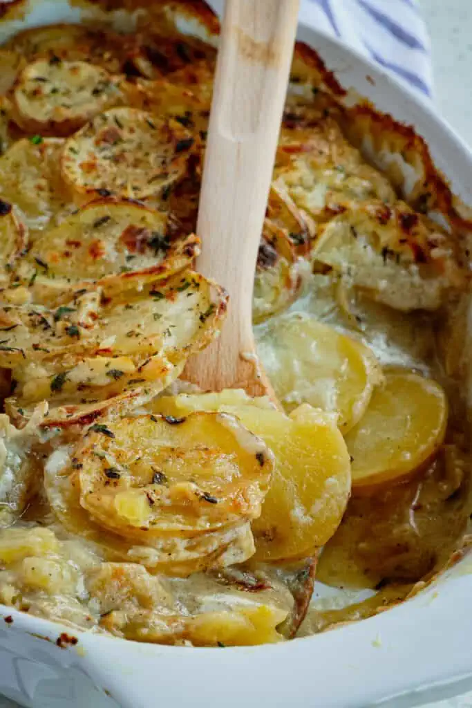Scalloped Potatoes are thin slices of potatoes baked up tender in a smooth and lightly seasoned cream sauce. 