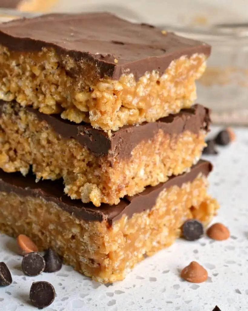 These easy Microwave Scotcheroos are chewy peanut butter rice krispie treats topped with a two-ingredient chocolate butterscotch topping. 