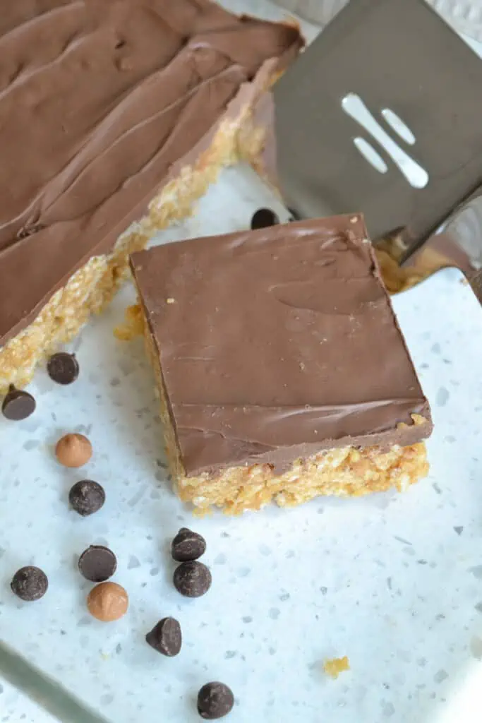 Family-friendly easy no bake microwaveable peanut butter rice krispie bars topped with melted chocolate and butterscotch.