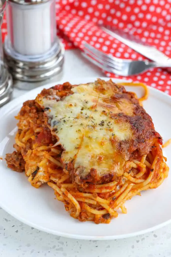 Baked Spaghetti Casserole, also known as Million Dollar Spaghetti Casserole combines ground beef, spaghetti, and spaghetti sauce with a mixture of cream cheese, ricotta cheese, and sour cream baked into the center. 