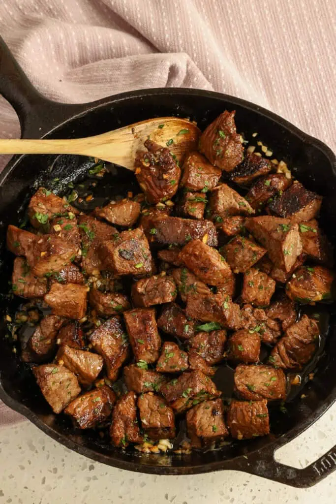 Bite size pieces of tender sirloin steak are smothered in garlic butter to make the best main entree or appetizers.