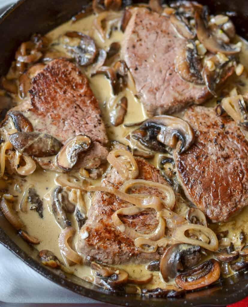 Steak Diane Steak Diane is served with a tasty sauce made from the pan juices, brandy, beef broth, and cream, with browned mushrooms.