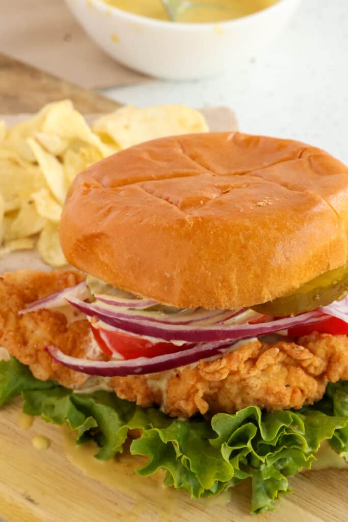Skip the fast food restaurant scene and make this easy tasty, Crispy Chicken Sandwich with a super crispy outer coating over tender moist chicken. 