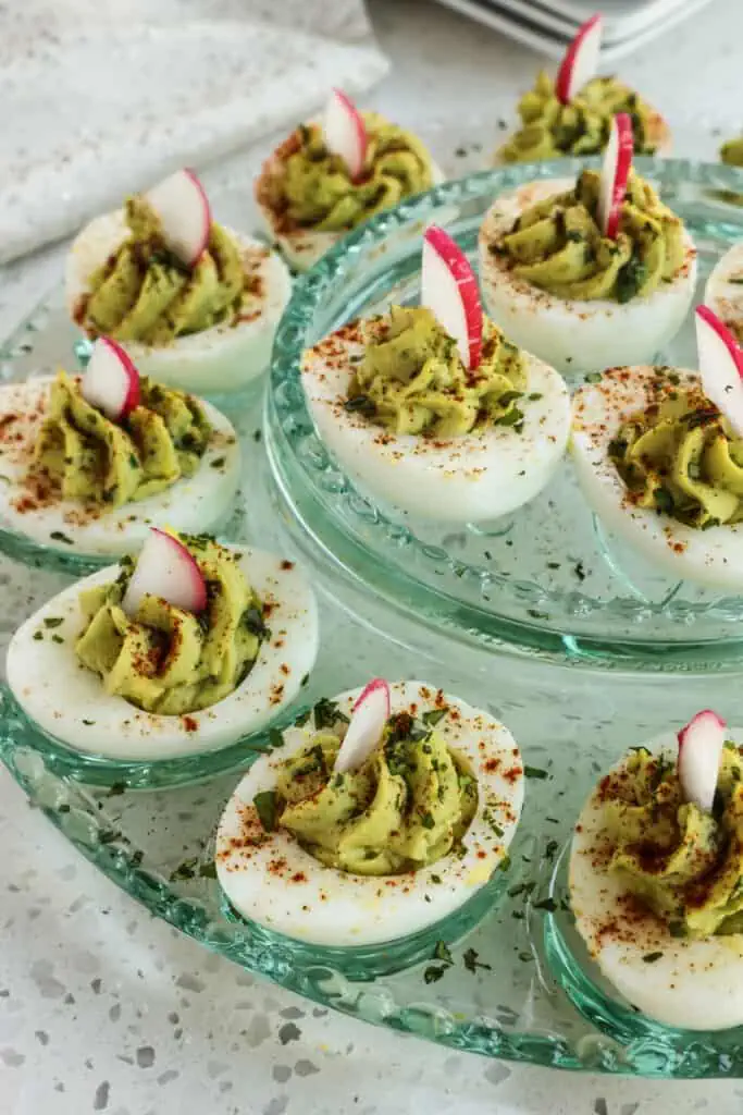 These quick and easy no-mayonnaise Avocado Deviled Eggs taste so smooth and creamy with the addition of fresh avocado. 