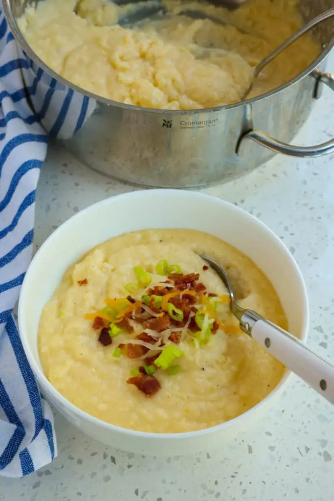 Smooth and creamy Cheese Grits is an easy side dish made with butter and cheddar cheese seasoned with salt, fresh ground black pepper, garlic powder, and a pinch of cayenne pepper. 