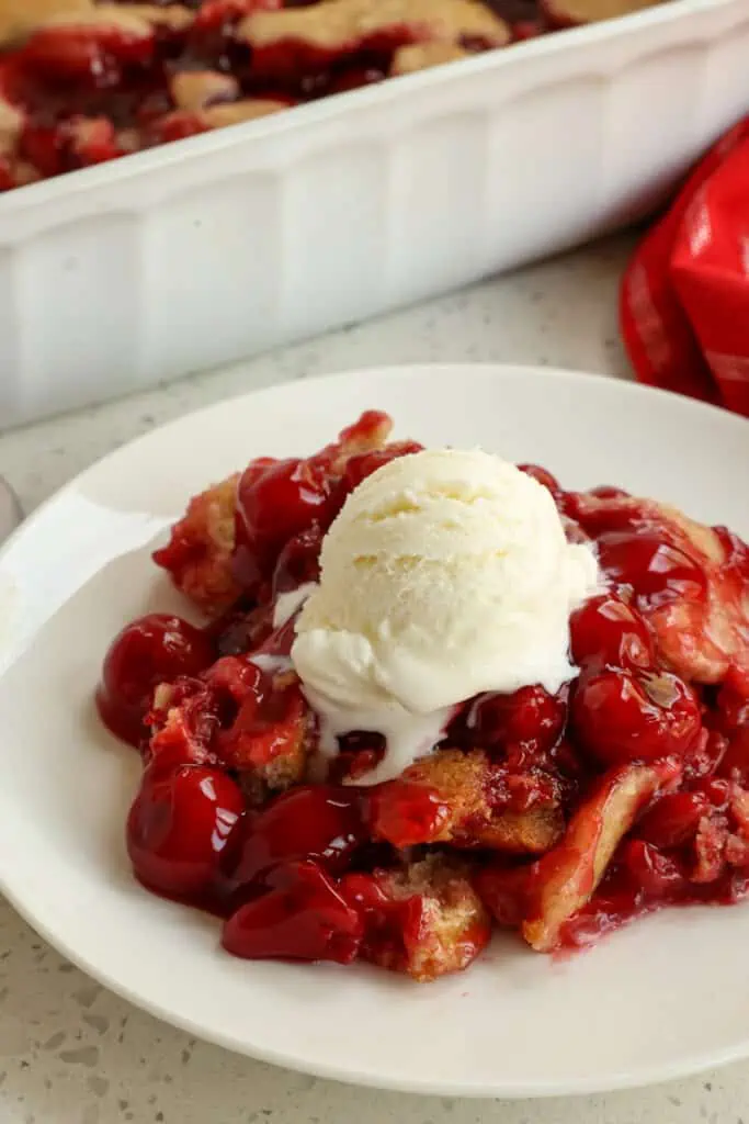 Quick and easy layered Cherry cobbler is ready for the oven in less than 10 minutes and uses common pantry ingredients and a can of premium cherry pie filling. 