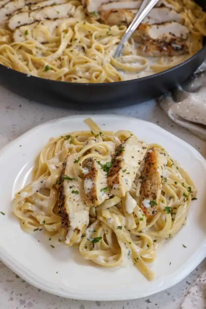 Cut the chicken into thin slices and add it to the pasta. Season with more salt and fresh ground black pepper to taste. If desired, sprinkle with freshly grated Parmesan cheese.