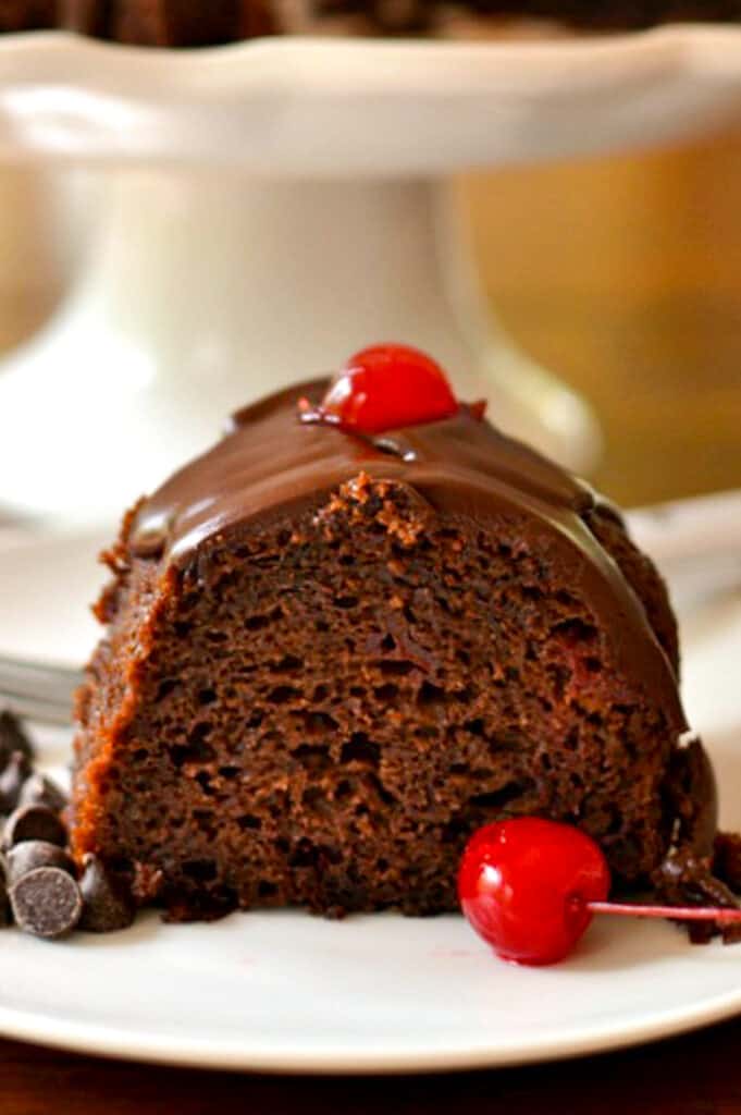 Chocolate Cherry Cake is a delicious rich cake with a delectable chocolate glaze that comes together quickly utilizing a devil's food boxed cake mix and cherry pie filling. 