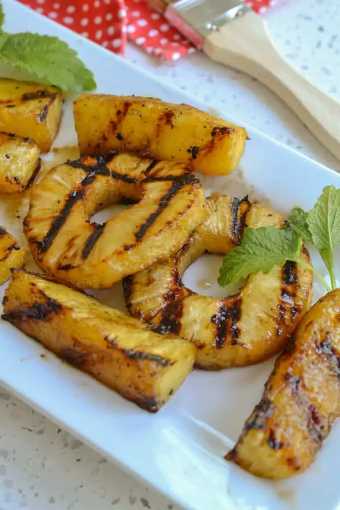 Delicious and simple, these five ingredient Grilled Pineapple spears or rings makes for the perfect side or dessert for all your spring and summer meals.
