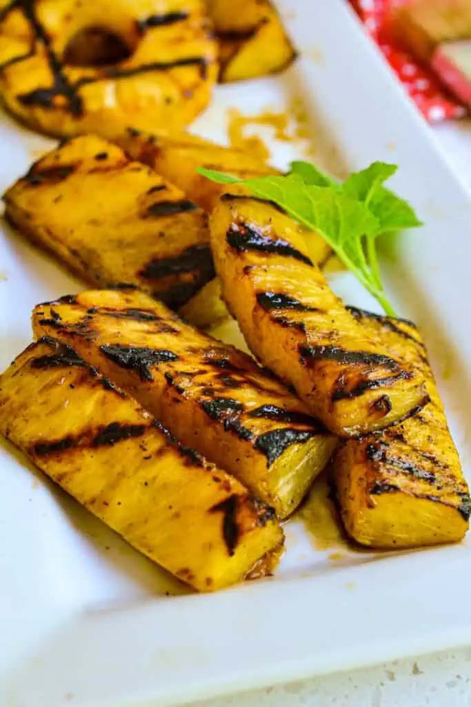 This mouthwatering Grilled Pineapple is marinated in four easy ingredients for about thirty minutes and then grilled to perfection on any outdoor or indoor grill. 