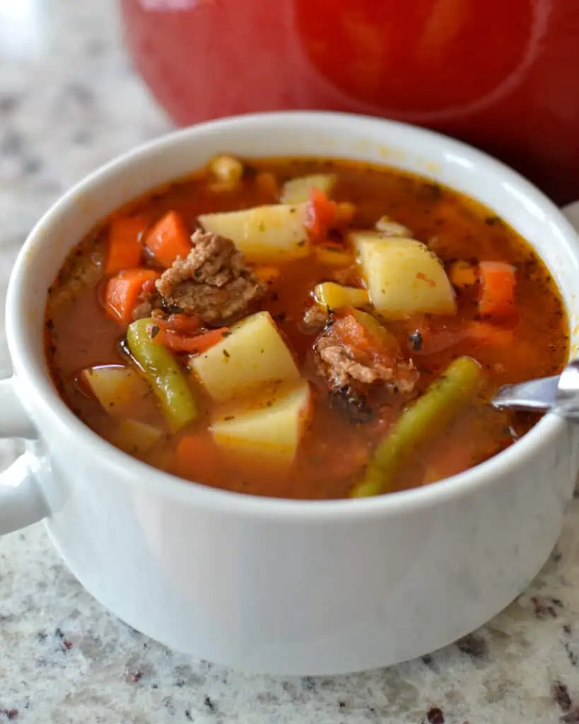 Hamburger Soup is the perfect blend of ground beef and fresh garden veggies like tomatoes, onions, carrots, and green beans.