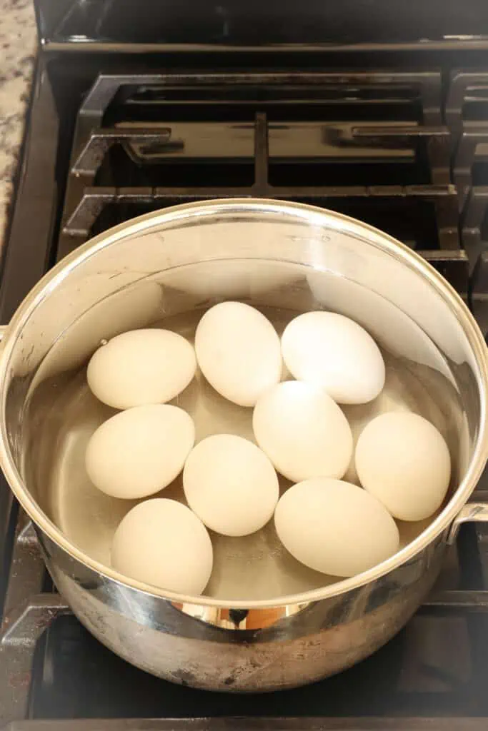 Add the eggs to a large pot without overcrowding. Fill the pot with cold water to an inch over the eggs,  
