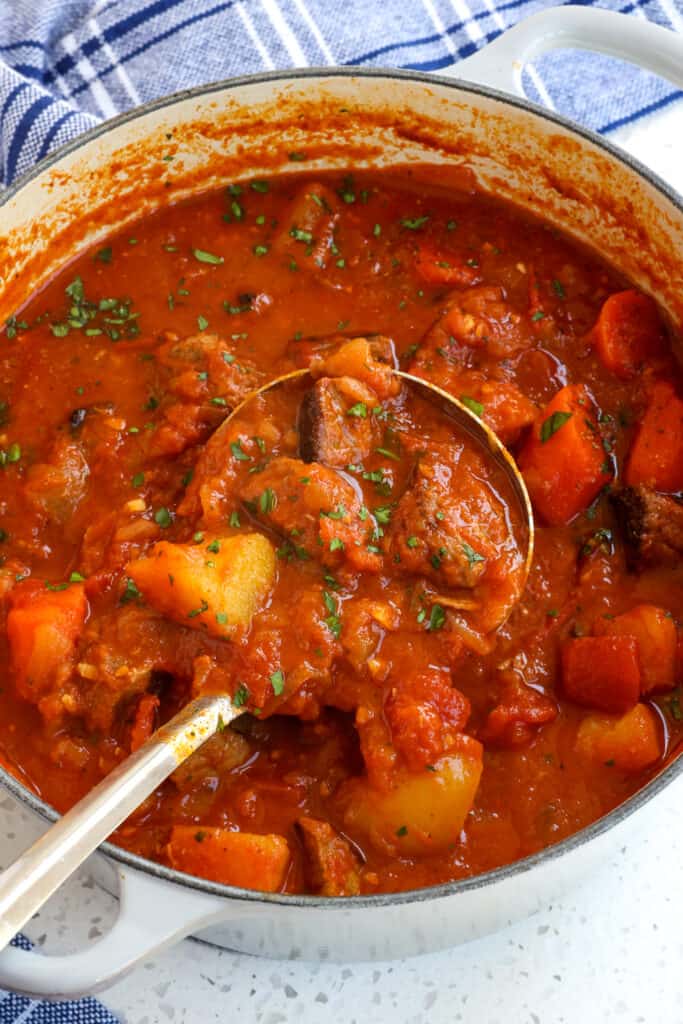 Hungarian Goulash is a slow-cooked tender beef stew (or soup) traditionally made with onions, potatoes, carrots, tomatoes, and sometimes bell peppers, all seasoned with sweet paprika, and caraway seeds.
