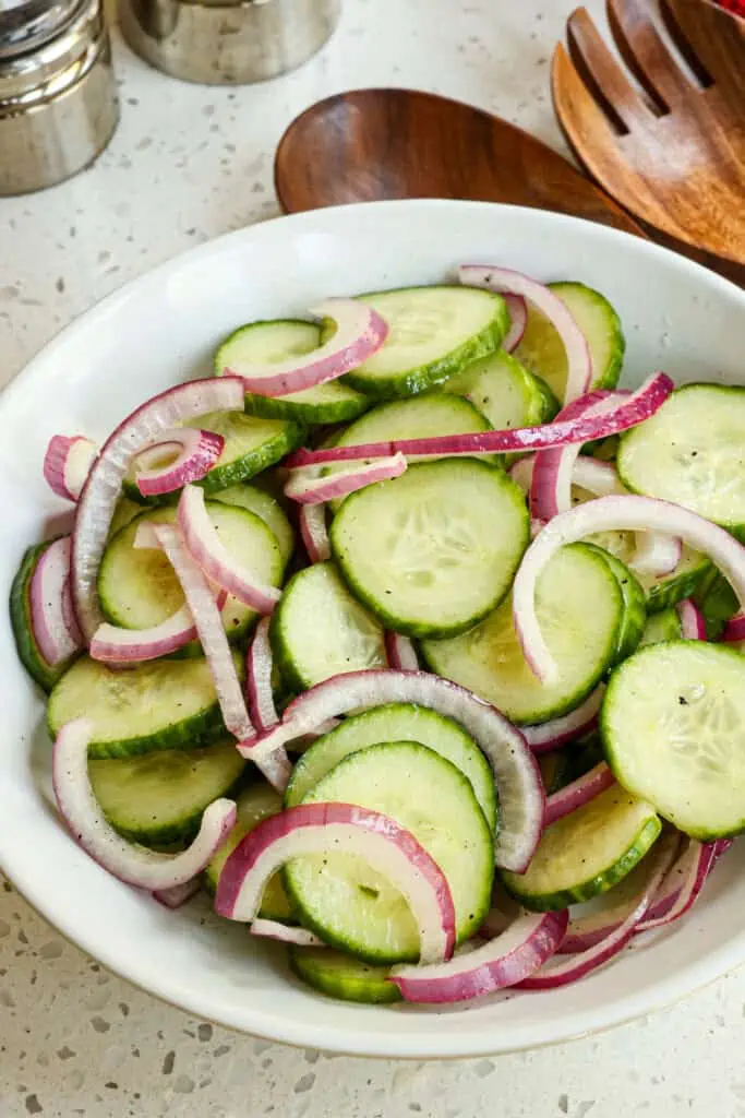 This easy Marinated Cucumber Salad is the perfect side dish for a summertime barbecue. Enjoy it with hot dogs, burgers, grilled chicken, or grilled pork steaks. 