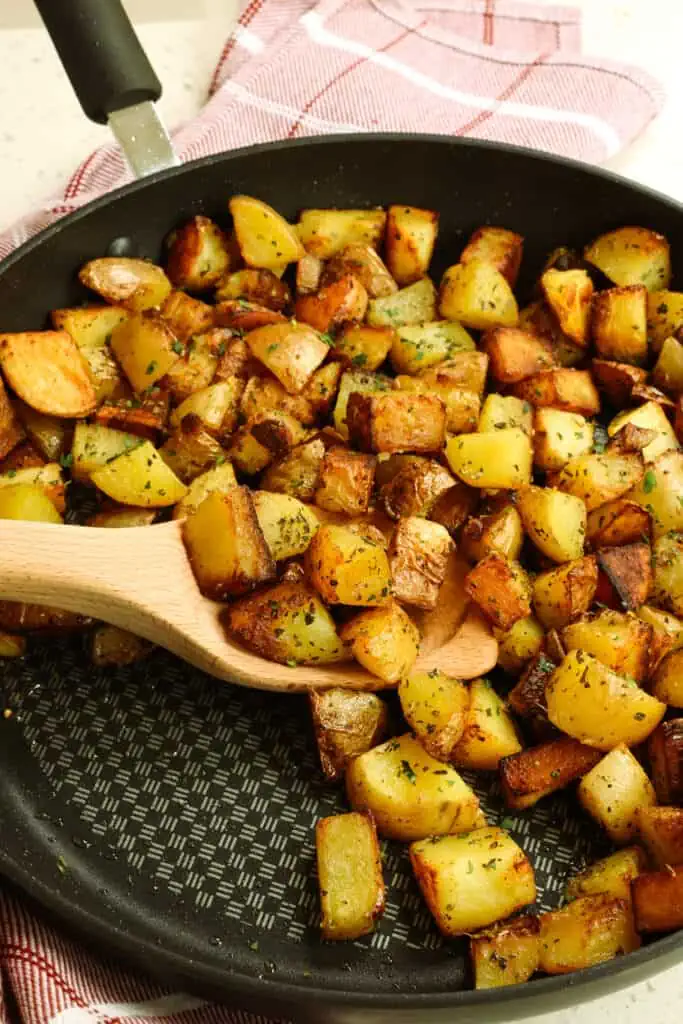 Perfectly cooked and seasoned crispy pan fried potatoes made without precooking or parboiling the potatoes.