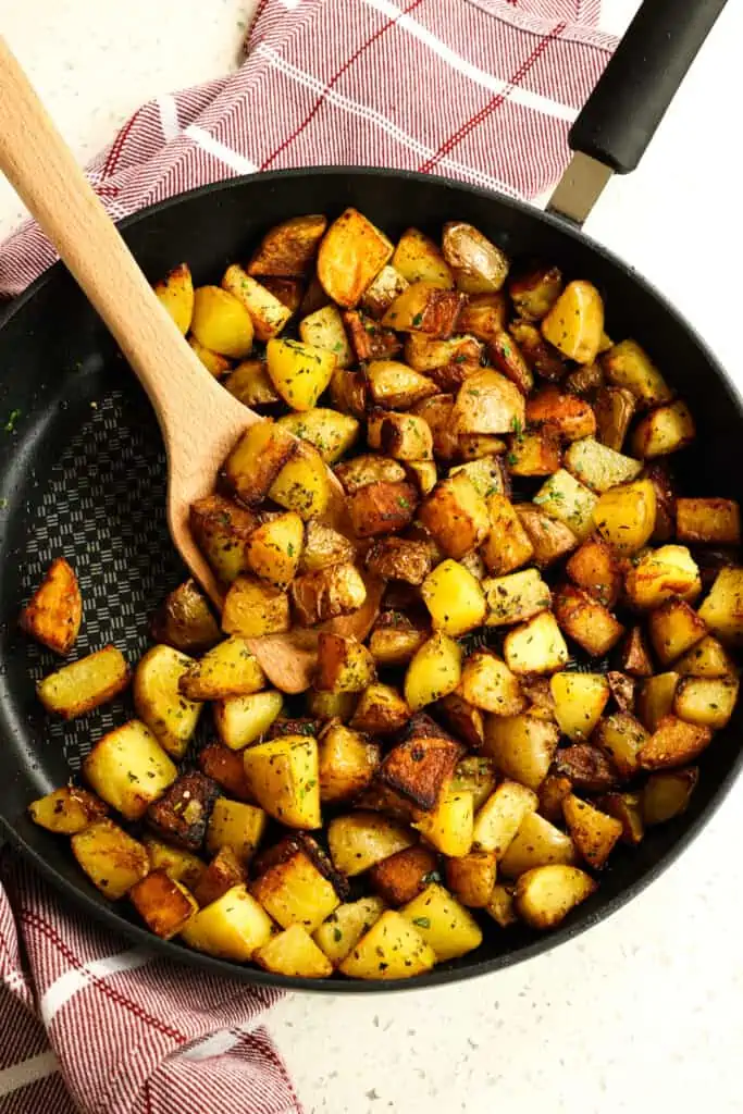 These quick and easy Pan Fried Potatoes cook up golden brown and crispy on the outside and tender and pillowy on the inside.
