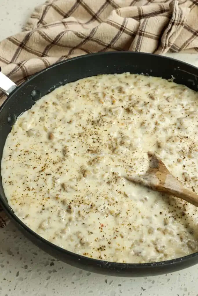 Slowly stir in the milk while cooking over medium-low heat. Cook the gravy for about 10 minutes or until thickened.