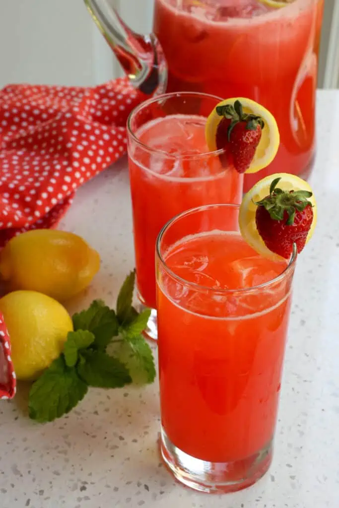 With a handful of ingredients, a little advanced preparation, and five minutes you can have a delicious cold strawberry lemonade thirst quencher for those hot summer days!!