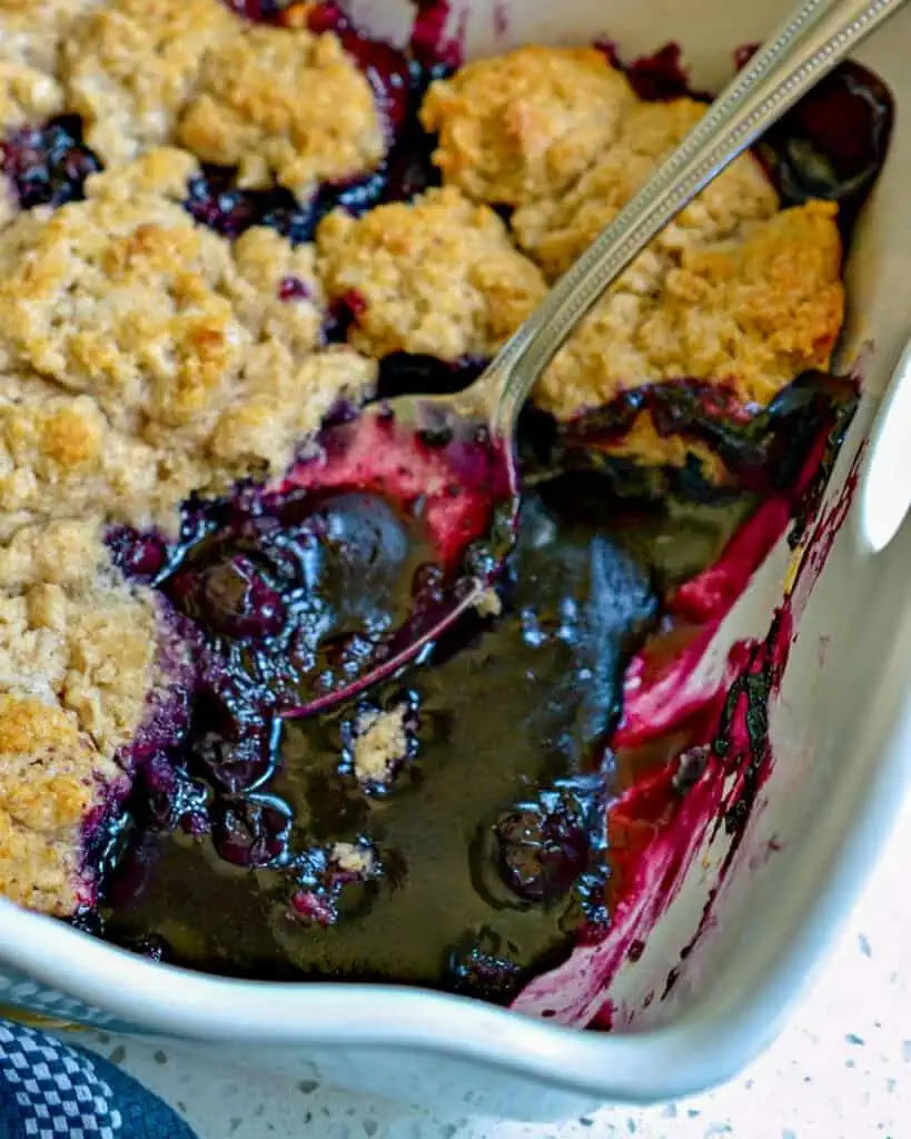 A family friendly lightly sweetened Blueberry Cobbler with a flaky biscuit topping with a touch of cinnamon.