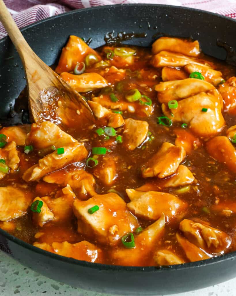 Bourbon Chicken Sauce Bourbon chicken simmering in a skillet
