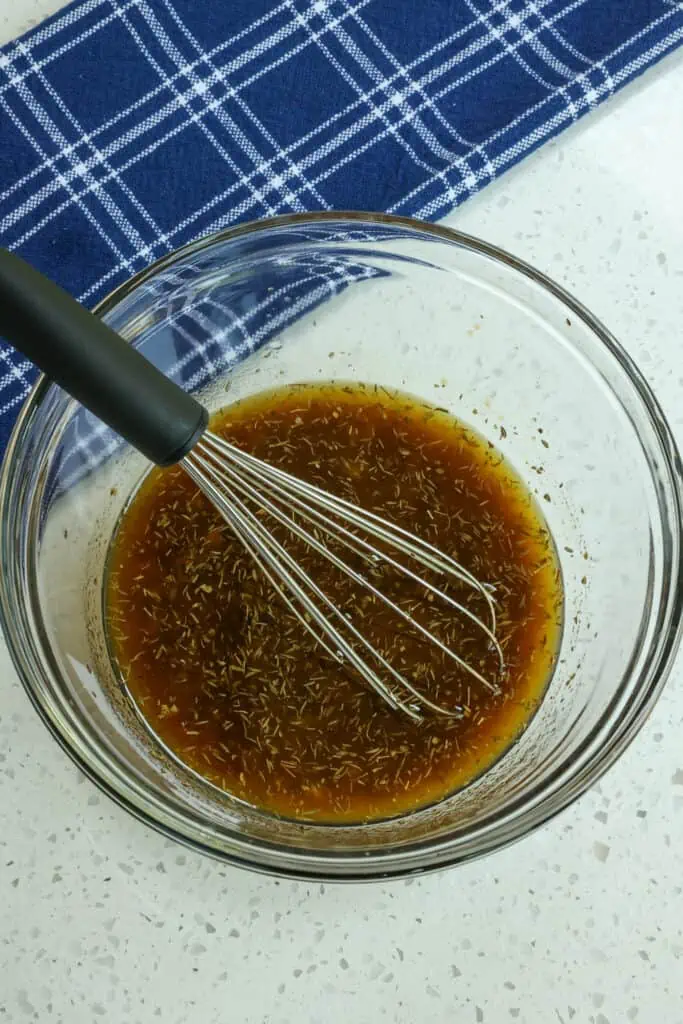 In a large bowl, whisk together the olive oil, soy sauce, Worcestershire sauce, lemon juice, brown sugar, minced garlic, dried thyme, and dried marjoram.