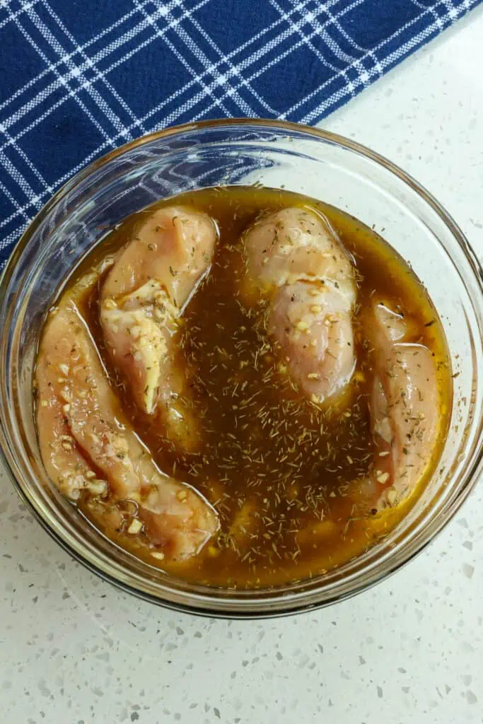 Add boneless skinless chicken breasts and marinate for at least 30 minutes up to 2 hours. Marinate bone-in skinless chicken breasts, things, drumsticks, and wings for 1-12 hours.
