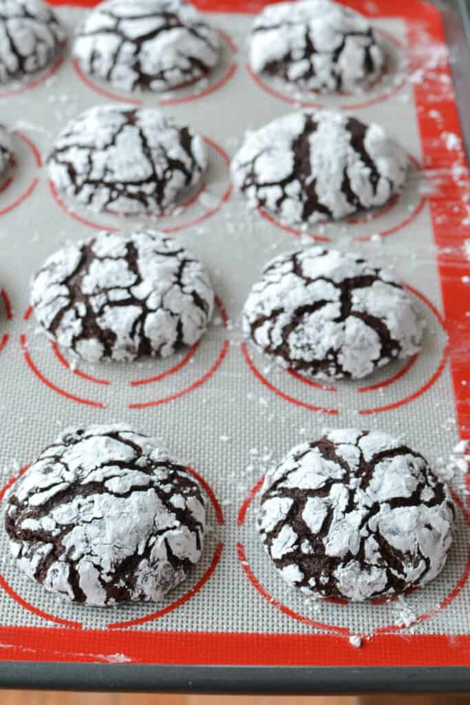 Delicious chocolate cake-like cookies with a soft melt-in-your-mouth texture and lovely crinkle appearance made easy by rolling the cookies in powdered sugar prior to baking.