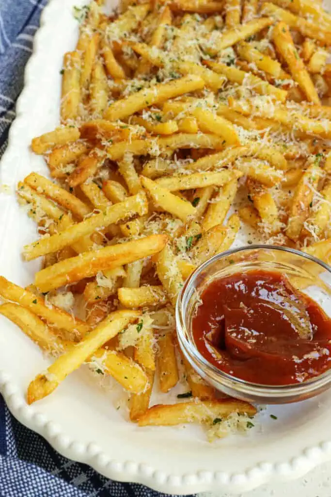 So much better than regular fries, these buttery, tasty, and easy Garlic Parmesan Fries are made in less than 20 minutes with common ingredients.