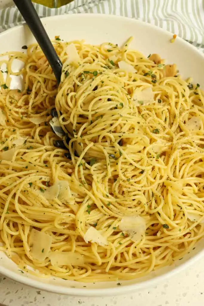 Enjoy this tasty Garlic Pasta with spaghetti, roasted sliced garlic, and Parmesan Cheese, all tossed with olive oil, parsley, and thyme.