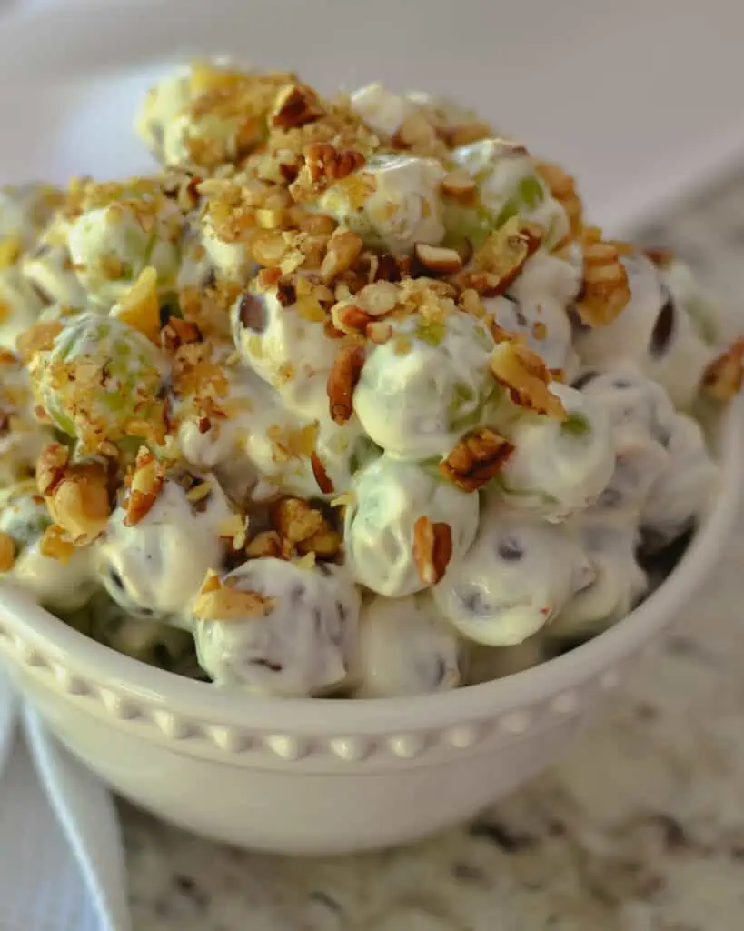This summer delight is a must-try. Grape Salad comes together in about ten minutes and makes for the perfect side dish, potluck, party salad, or dessert.  