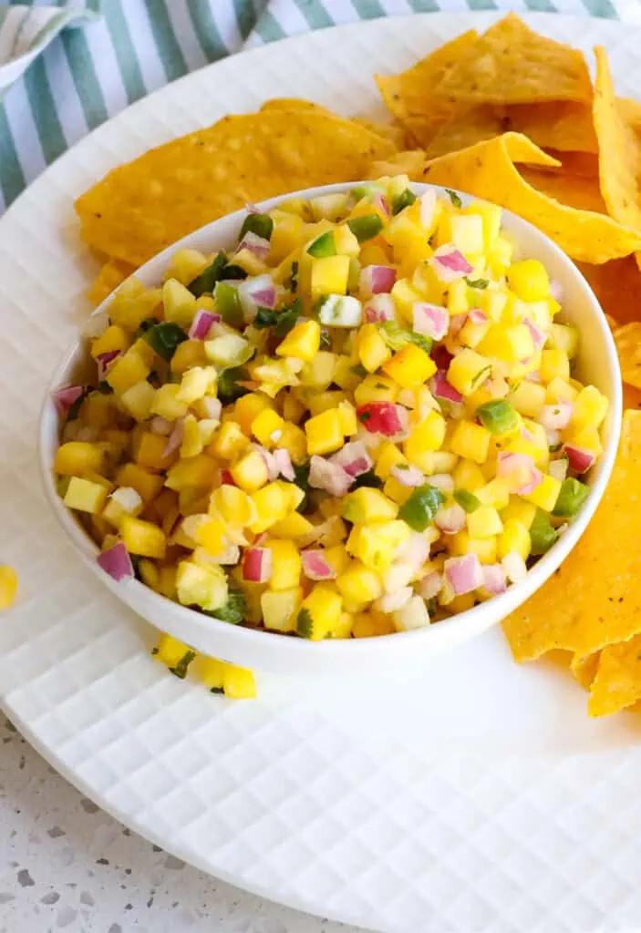 In a medium bowl combine the mango, red onion, jalapeño, cilantro, chili powder, salt and lime juice.