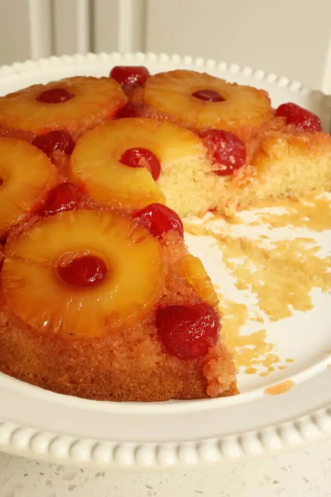 This easy Pineapple Upside Down Cake bakes up perfectly every time with sweet caramelized pineapple and maraschino cherries on a moist and buttery cake with slightly crispy edges from the cast iron skillet. 