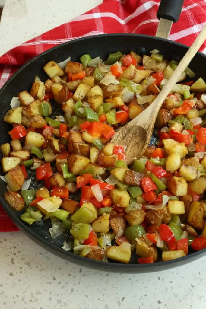 Add the cooked vegetables back to the skillet and stir to combine and warm. Season with kosher salt and fresh ground black pepper. 
