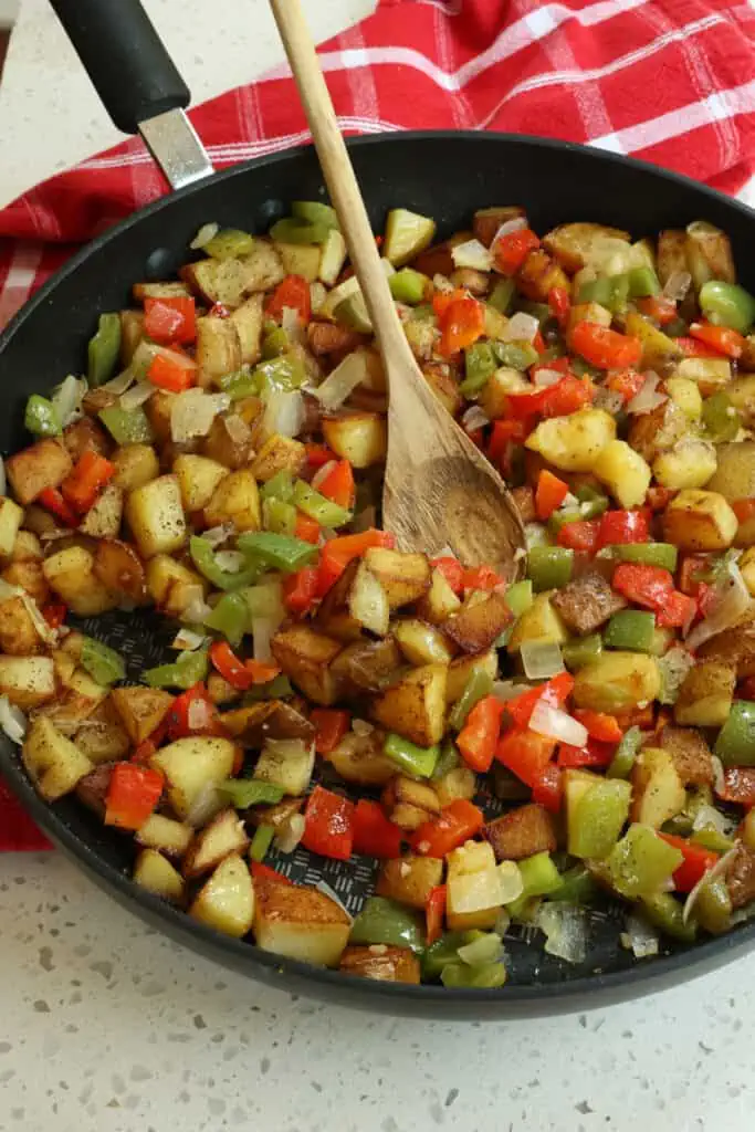 Tasty Potatoes O'Brien with flavor from onions, bell peppers, and garlic, seasoned with simply with kosher salt and fresh ground black pepper.