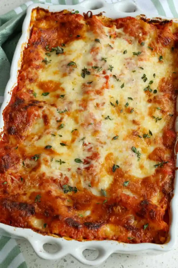 This amazing meatless classic Vegetable Lasagna Recipe is layered with flavor from smooth ricotta cheese, sautéed vegetables like mushrooms, zucchini, bell peppers, and spinach, mozzarella cheese, and marinara, all baked to golden perfection. 